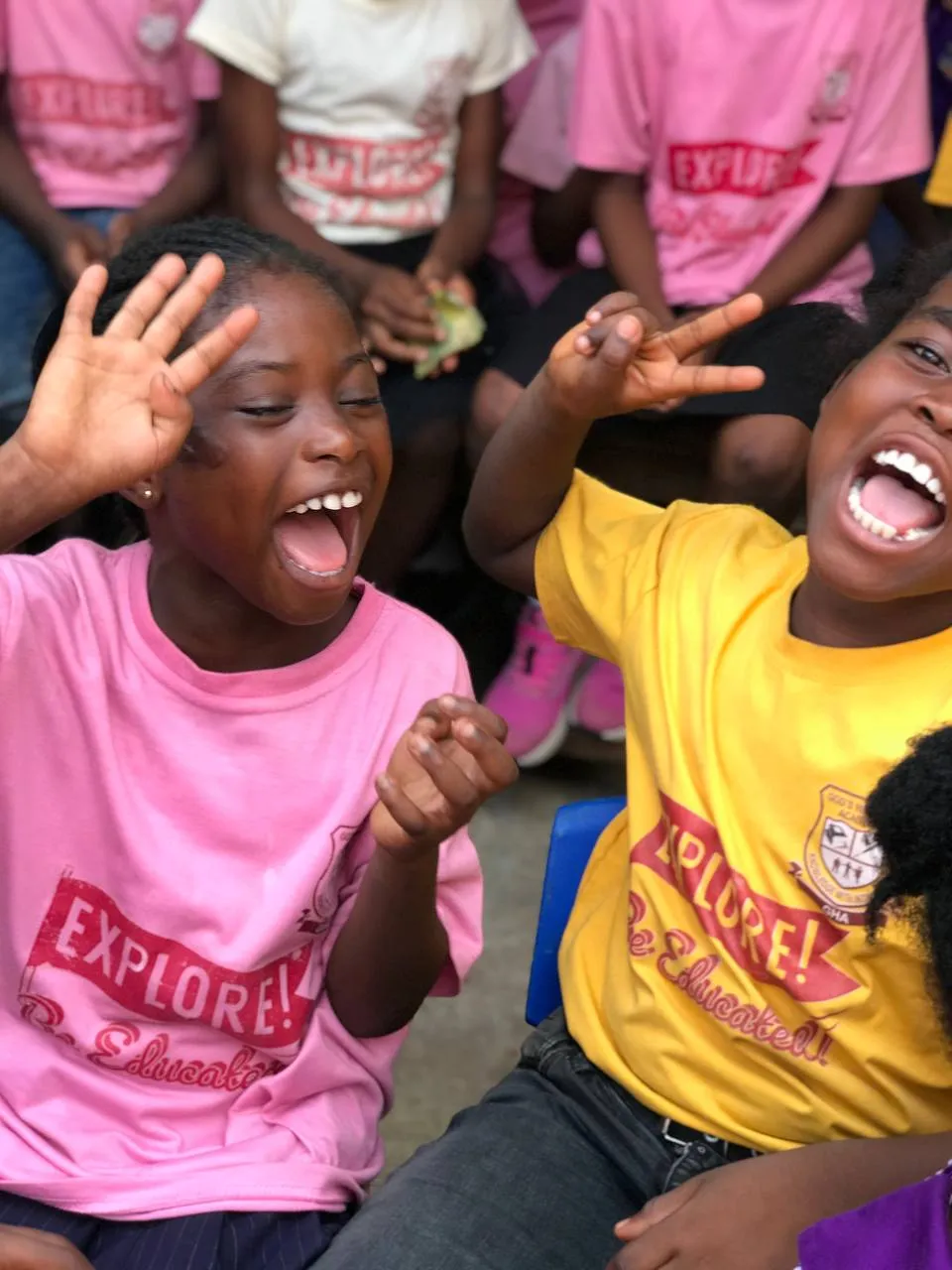Two pupils laughing together